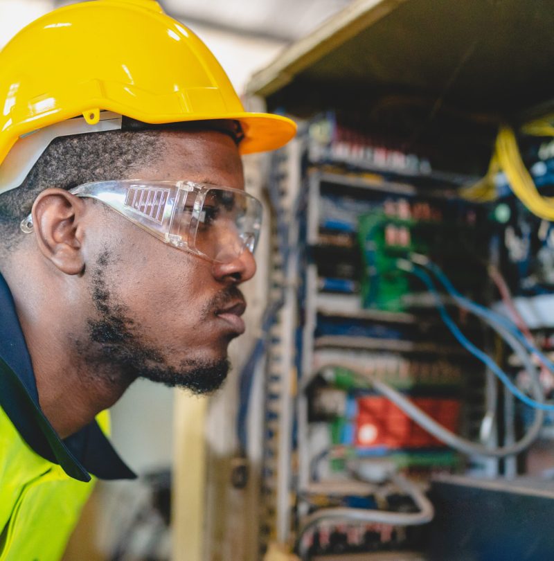 professional business industry technician wearing safety helmet working to maintenance service and checking factory equipment, a work of engineer occupation in manufacturing construction technology